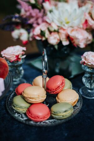 Romantic table setting with macaroons and flowers.の写真素材