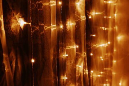 Abstract golden background. Festive bokeh lights background.の写真素材