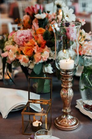 Beautiful, decorated table with flower decorations.  Wedding or party decorations.の写真素材