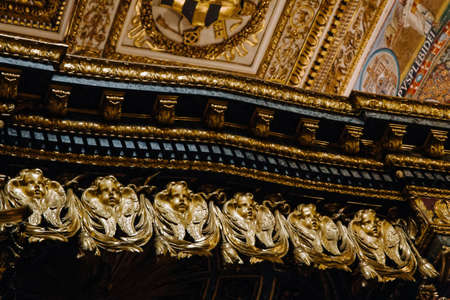 Golden heads, ceiling decoration, luxury interior detail.の写真素材