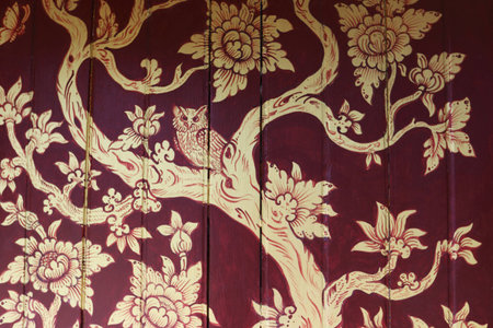Painting on a wooden board about a owl on a tree branchの写真素材