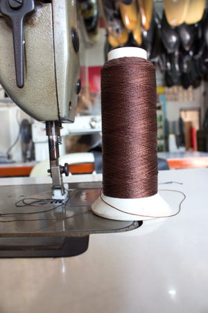 sewing machine in action for working leatherの写真素材