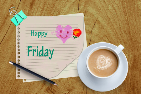 Happy Friday word and coffee cup on wooden background.の写真素材