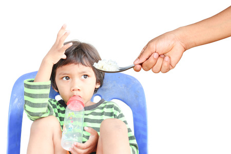 Children who are tired of rice. focus at rice.の写真素材