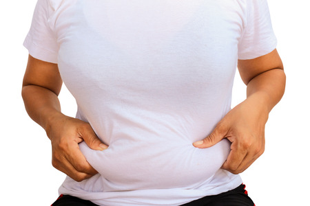 Women show her fat bellyの写真素材