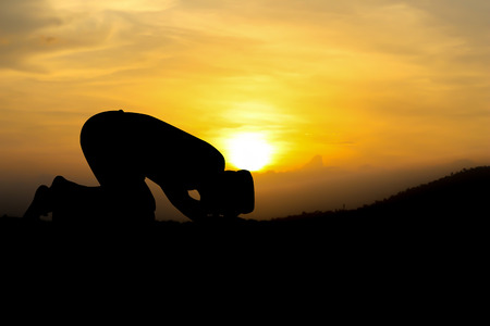 man praying to allah god of Islam on sunset.の写真素材