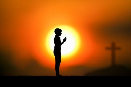 people  praying at the sunset.の写真素材