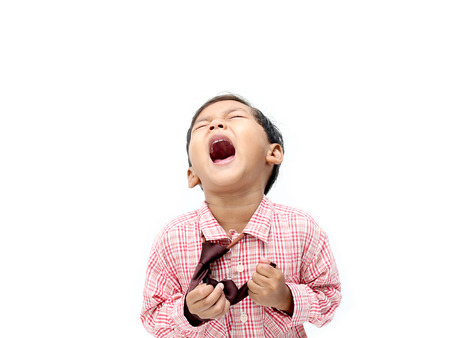 happy big laughing asian boy on white background.の写真素材