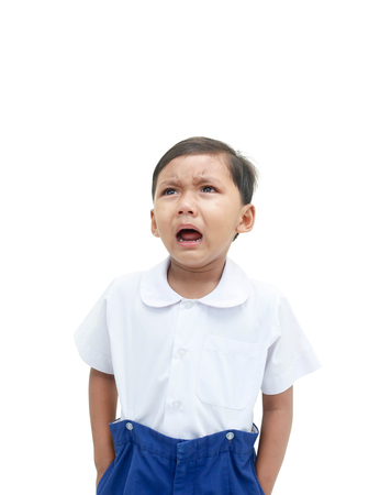 Crying boy in school uniformの写真素材