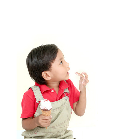 little boy with ice cream on white background.の写真素材