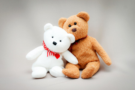 toy teddy bear on gray background.の写真素材