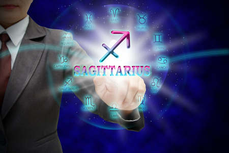 Astrologer woman's touch to technology background of the horoscope ,with 12 zodiac.の写真素材