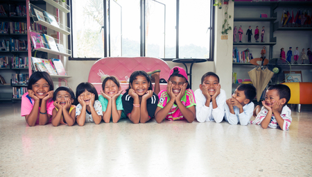 Satun Thailand,17-desember-2016; boys and girls  asian children in library and have smiley in face,Thailand land of smile can you see smiley in face everybody.vintage style filter.のeditorial素材