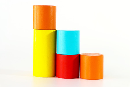 Colorful wooden toy block fulfilled on white background.の写真素材