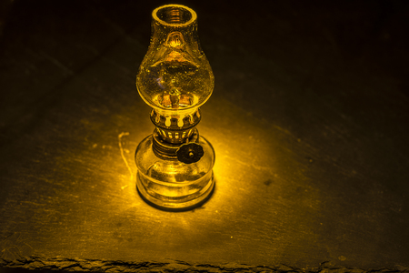 Old photocamera and vintage oil lampの写真素材