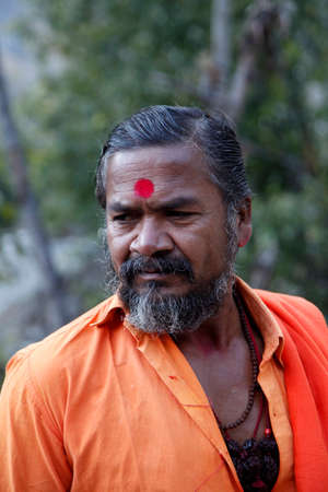 Indian Baba, Swami, Sadhu, Holyman, Saddhu in front of temple in Haridwar, Uttrakhand, Indiaのeditorial素材