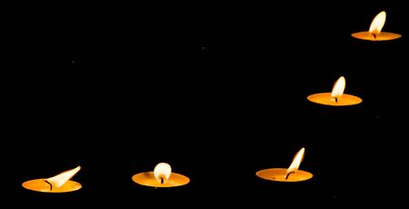 Five wax candles in the darkness best to make greeting cardsの写真素材