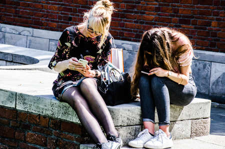 Rotterdam / Netherlands 12th May: Two ladies looking at the smart phones 2018: