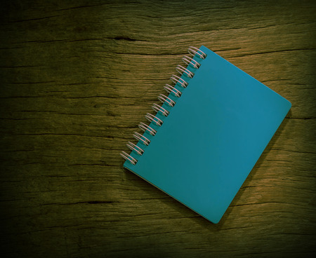 blue notebook with vintage background of  old wood.の写真素材