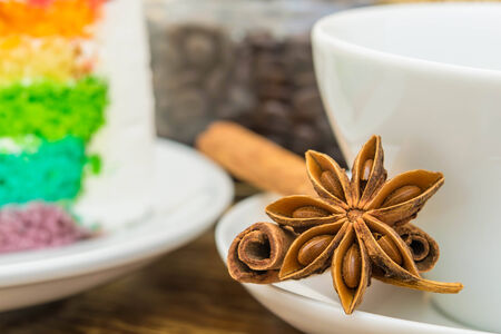 Close-up of anise stars and cinnamon sticks on wood backgroundの写真素材