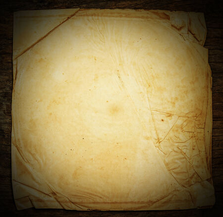 Old paper on the wood backgroundの写真素材