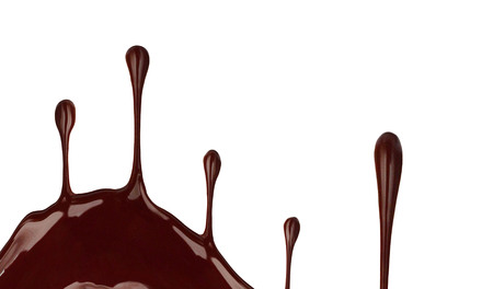 Melted hot chocolate is pouring. Liquid Jet isolated on white.の写真素材