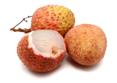 Fresh lychees with leaves isolated on white backgroundの写真素材