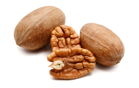 Pecan nuts isolated over white background