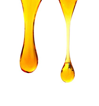flow of sweet honey on the white background. Isolated.の写真素材