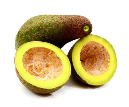 avocado and half isolated on white backgroundの写真素材