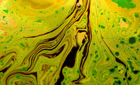 Artist palette with mixed oil paints. Abstract background with colorful brush strokes on a canvas. Multi-color paint background.の写真素材