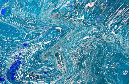 Blue and gold abstract hand painted background. Drawing, paint.