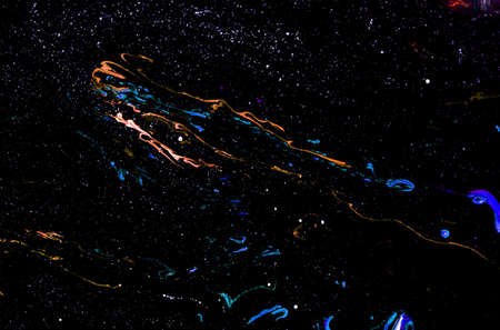 Abstract colored background from spilled paints