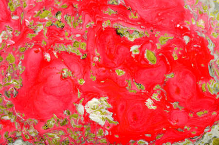 Acrylic Fluid Art. Mixing red, white and coral acrylic paints. Abstract marble background or texture