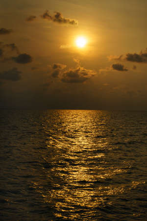 Golden beautiful sunset is over the ocean.の写真素材
