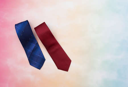Happy family scene of two tie gifts for father or dad in father's day with colorful backgroundの写真素材