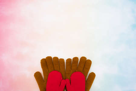 Represent family scene of dad holds child hands at bottom with colorful background. Represent child and father by unbranded glovesの写真素材
