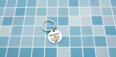 Keychain gift from child in father's day on blue table