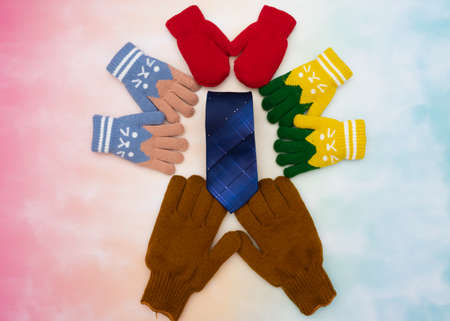 Happy family scene of son, daughter, and child gives blue tie gift to father in father's day with...