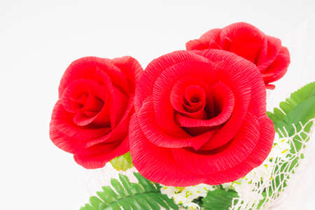 focus one of three red rose flower in bunch on white background, beautiful elegance red roses flower of love inspiration in anniversaryの写真素材