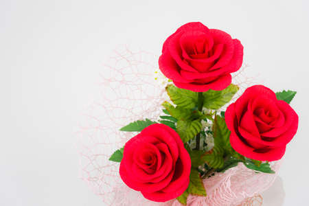 bunch of red rose flower in white background with copy space at left side, beautiful elegance red roses flower of love inspiration in anniversaryの写真素材