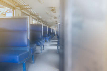 vintage seat on iron train for passenger in train station, train in asia thailand for departure or arrival pathの写真素材