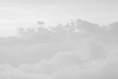 white abstract of beautiful sunlight and cloud on sky while sunrise or sunset for background, landscape view of cloud on peak mountain at national park in asia-thailandの写真素材