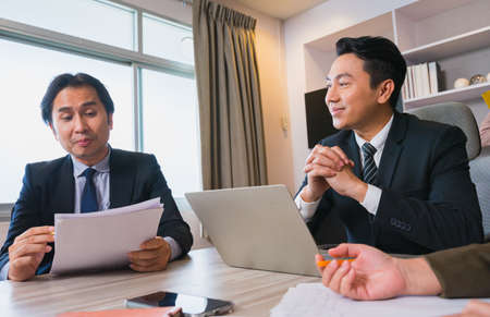 manager listen worker report on business success in business team meeting, leadership businessman work professional businesswoman on business team discussion in corporate meetingの写真素材