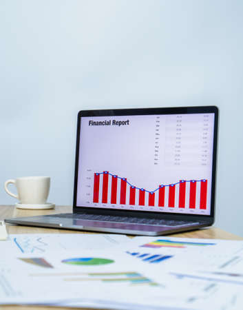 business data graph on laptop with copy space for making meeting presentation, professional businessman busy work on the business data graphの写真素材