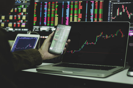 Investor analyzing stock market or forex trading graph and candlestick chart suitable for financial...