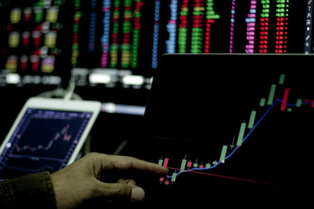 Stock exchange market trading at home. Work at home. Financial and economic concept. Stock market graph on laptop.の写真素材