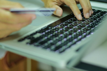 Man hand working with lobtop keyboard on shopping online with credit card. Shopping online concept.の写真素材
