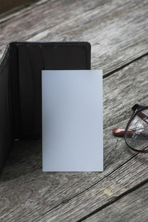 Name card mock up with card holder on old wooden table backgroundの写真素材