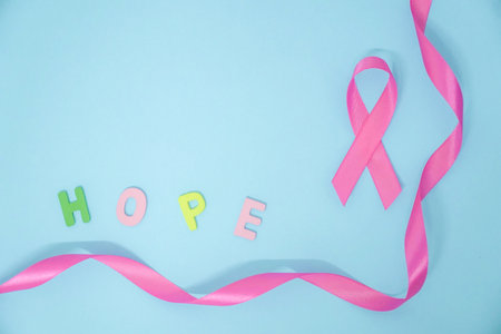 October Breast Cancer Awareness. Pink Ribbon on green backgroundの写真素材
